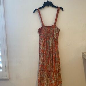 Orange dress has only been used once in good condition